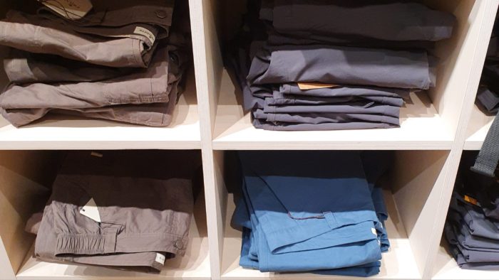 Trousers stacked up at the store
