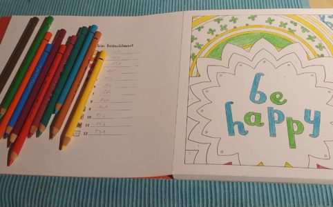 Colouring Book with a "Bee Happy" drawing and 12 colour pencils