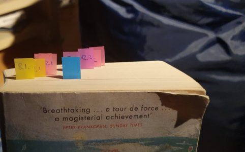 Top of "The Boundless Sea", many pages marked with colourful post-its. One for every week till 24th February