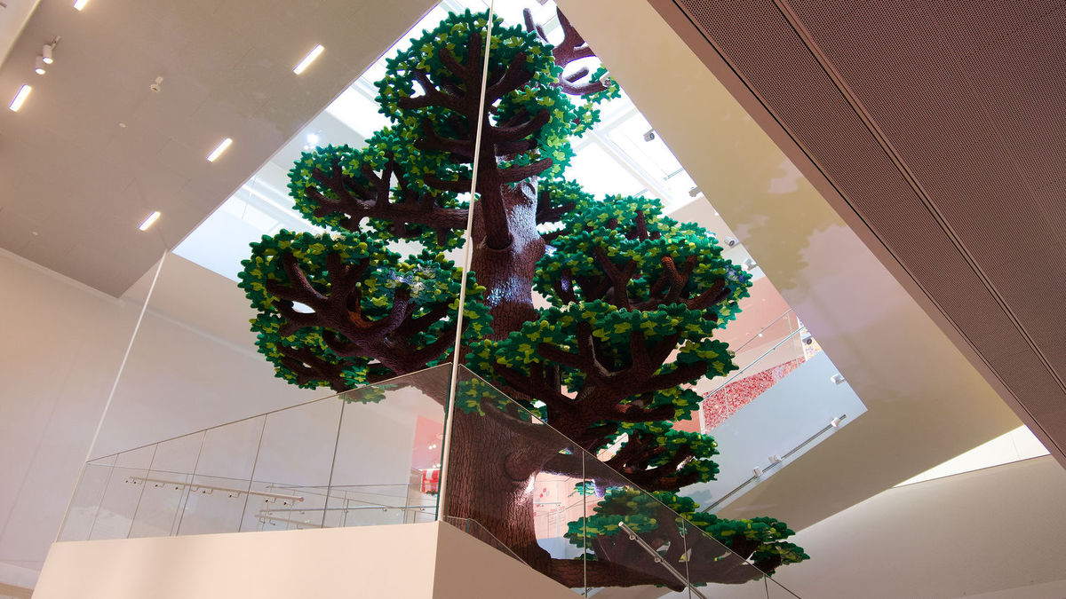 Photo of a 3-store-high Lego tree inside the LEGO House