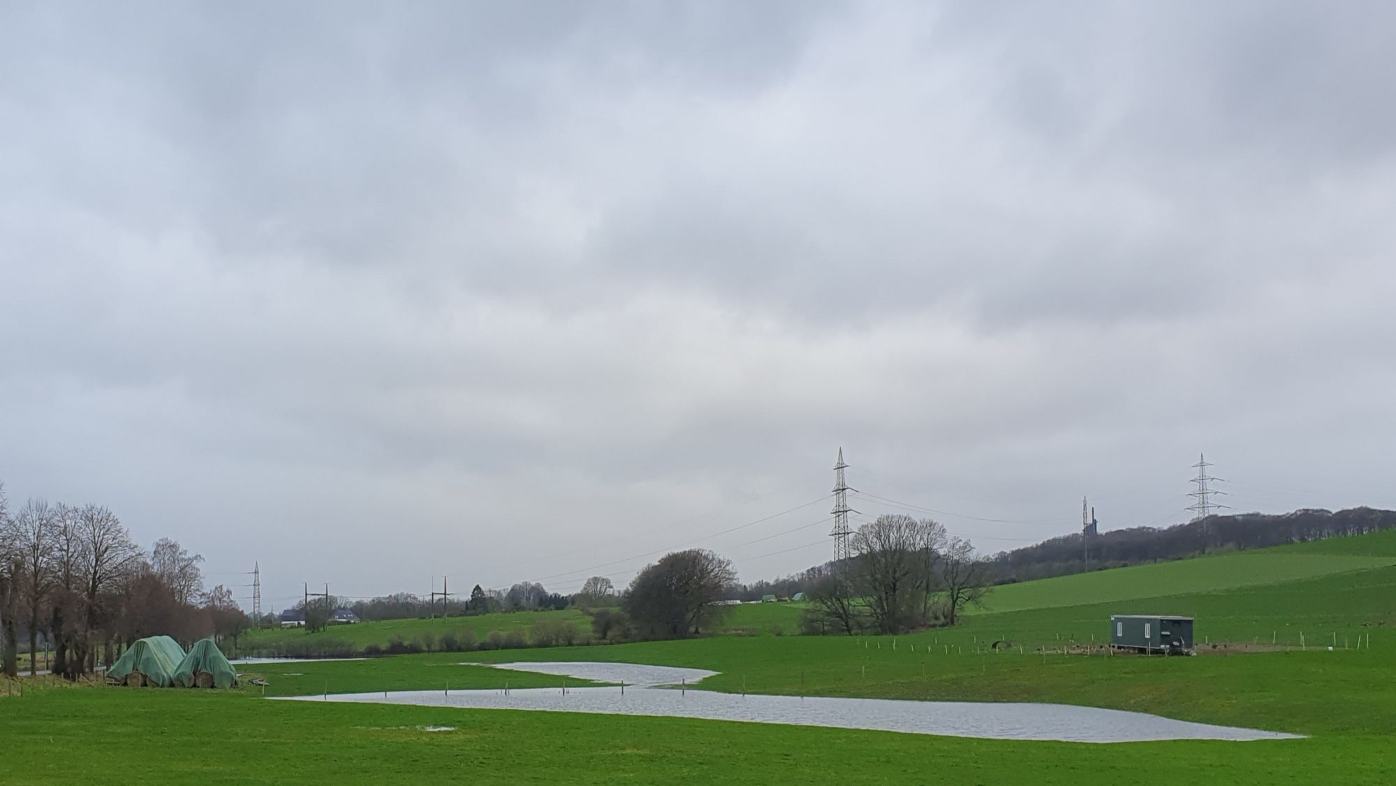 Photo of a partially flooded meadow under a grey sky