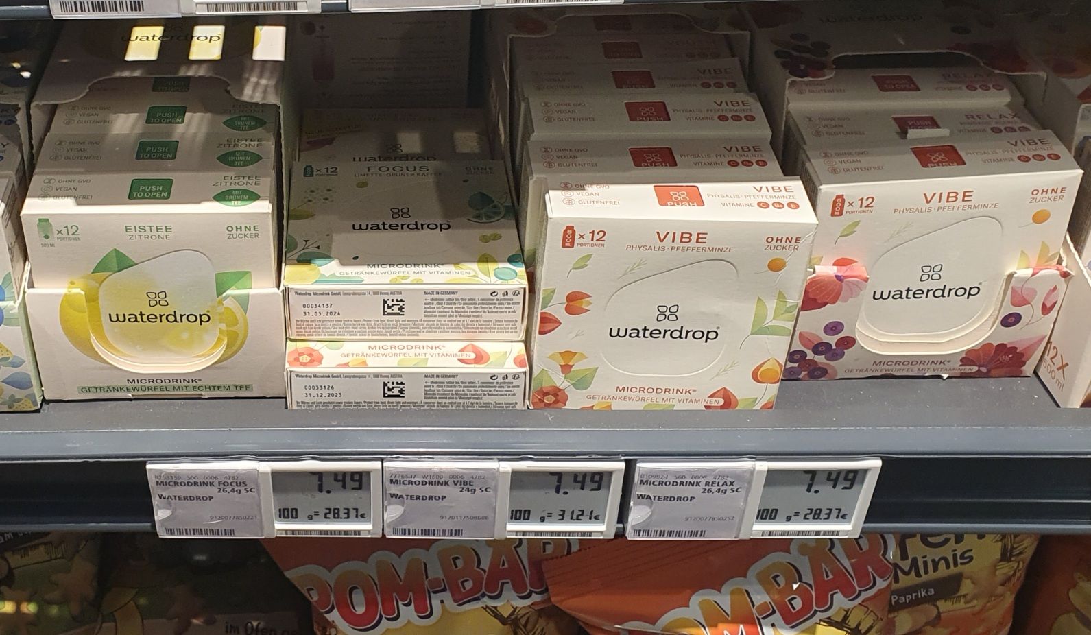 Photo of a boxes of micro drinks on a supermarket shelf