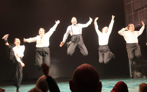 Photo of the jump during the final applause of the Operation Mincemeat cast