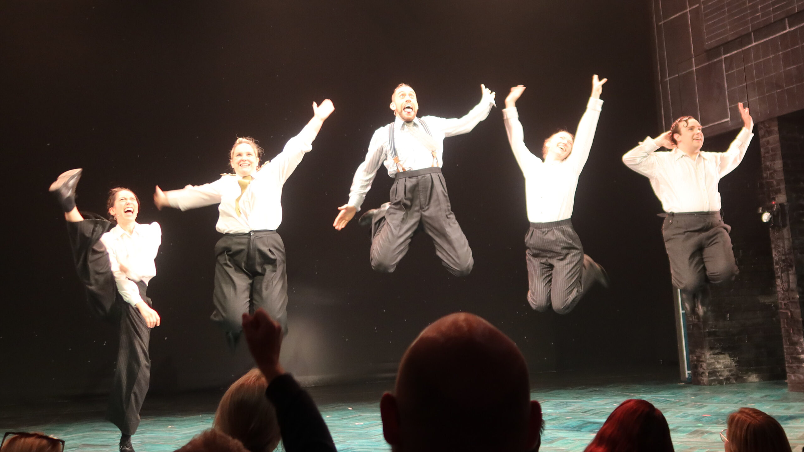 Photo of the jump during the final applause of the Operation Mincemeat cast