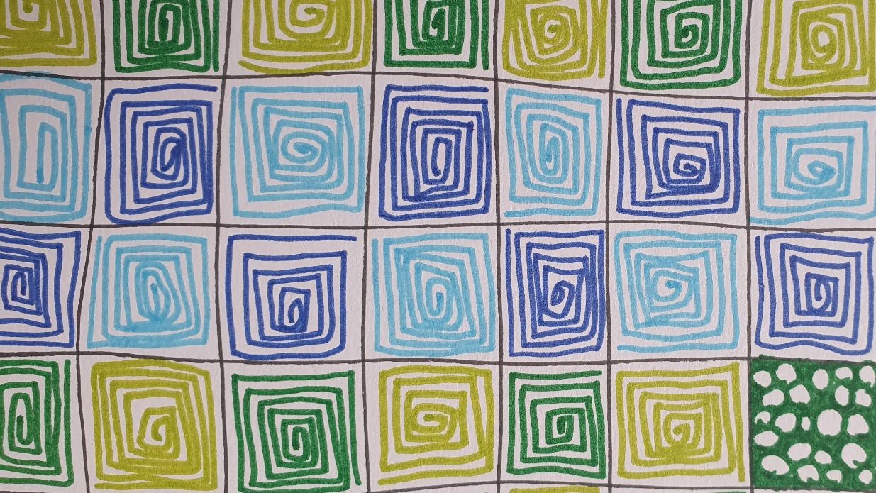 Photo of my doodling. Paper divided in black squares, each filled in with lines in different colours