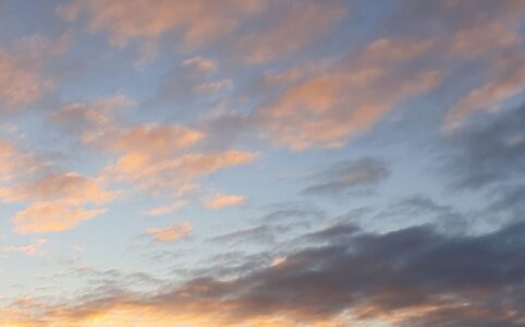 Clouds at sunrise, lower right corner has leftover dark clouds from the storm