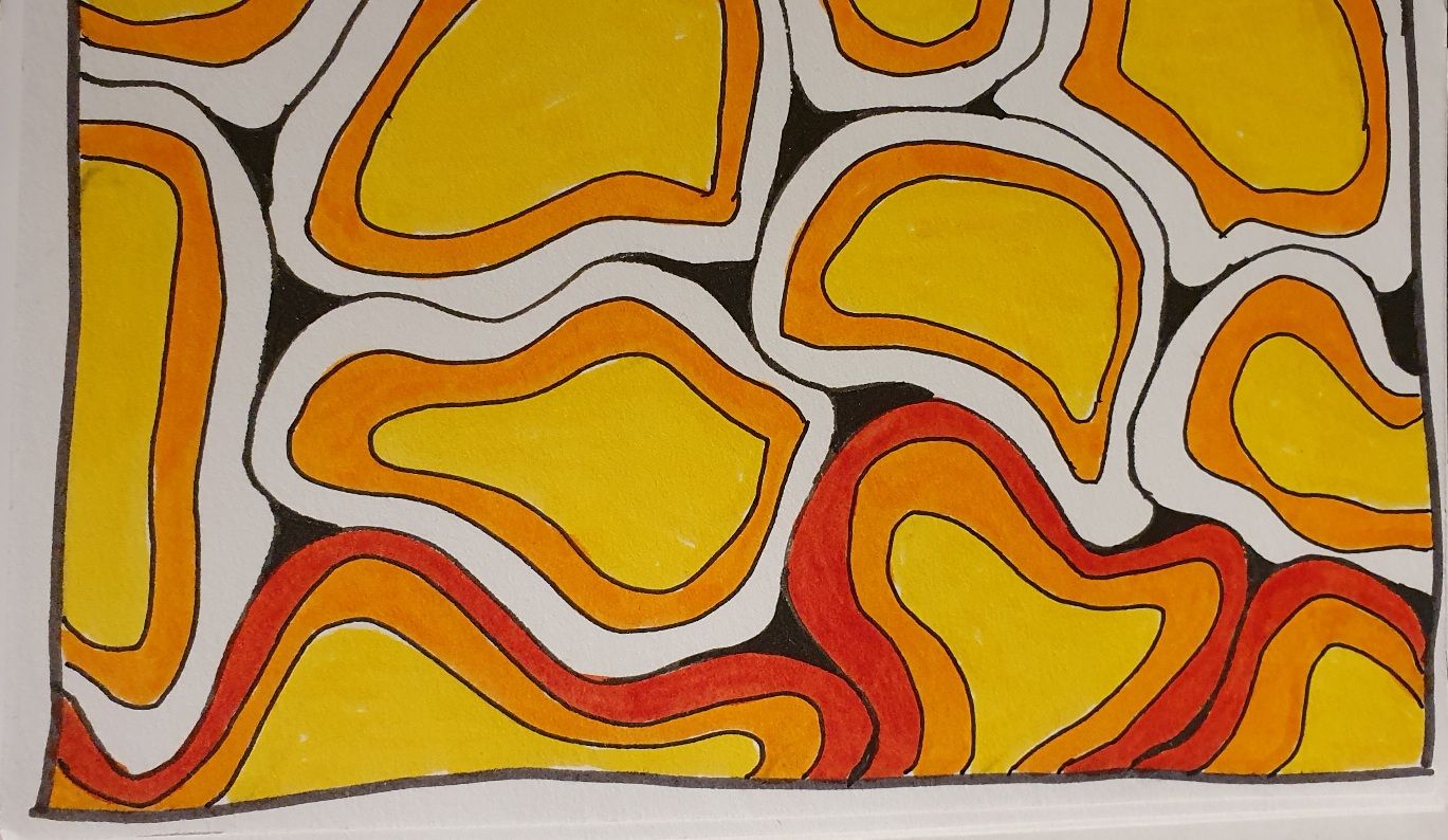 Doodle of circle shapes, most coloured in yellow centre, orange and red border