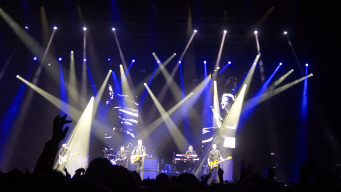 Frank Turner and the Sleeping Souls on stage with lots of colorful lights