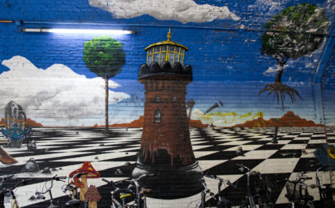 Mural in a railway underpass, Helios tower on a chessboard