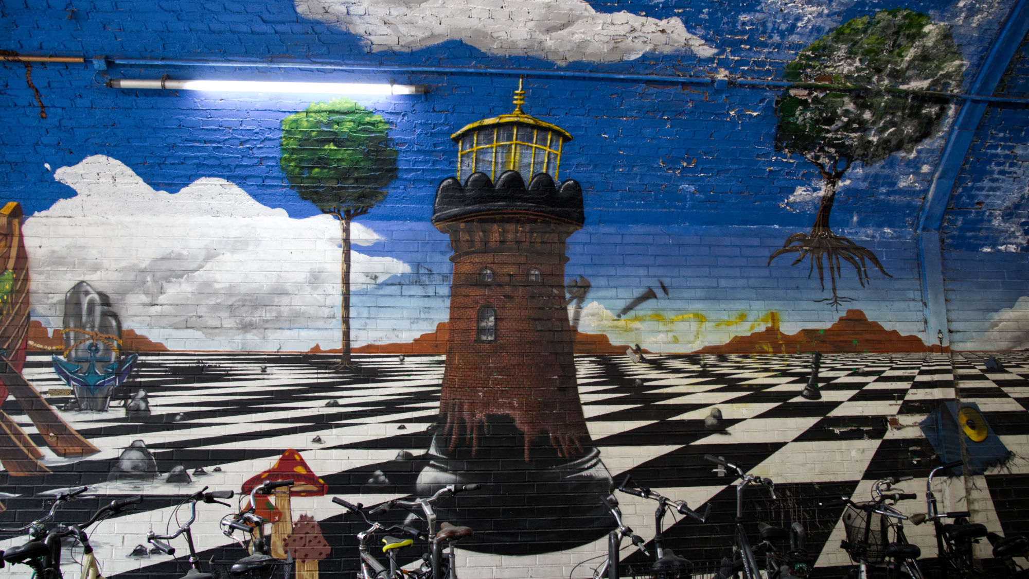 Mural in a railway underpass, Helios tower on a chessboard