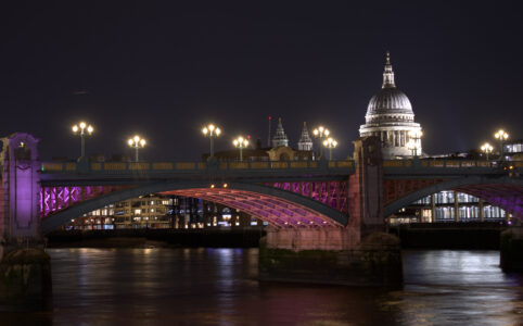 St. Pauls and illuminated Southwark Bridge by night